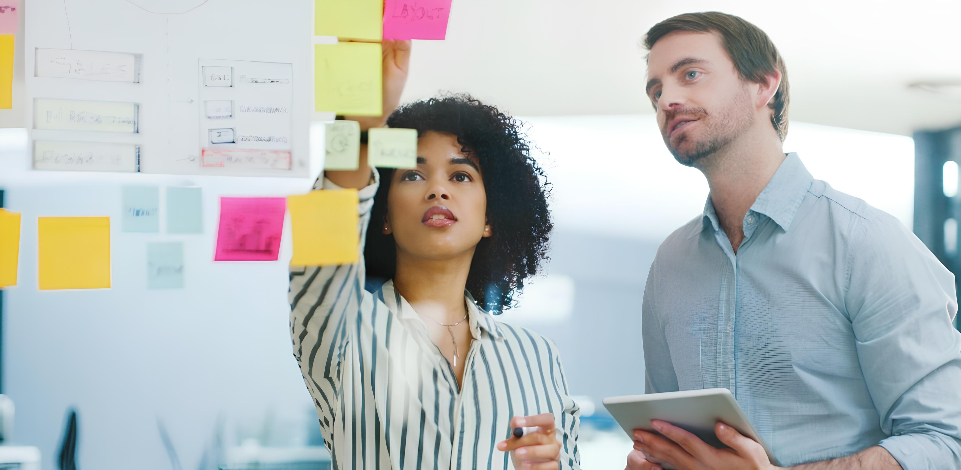 People collaborating with sticky notes